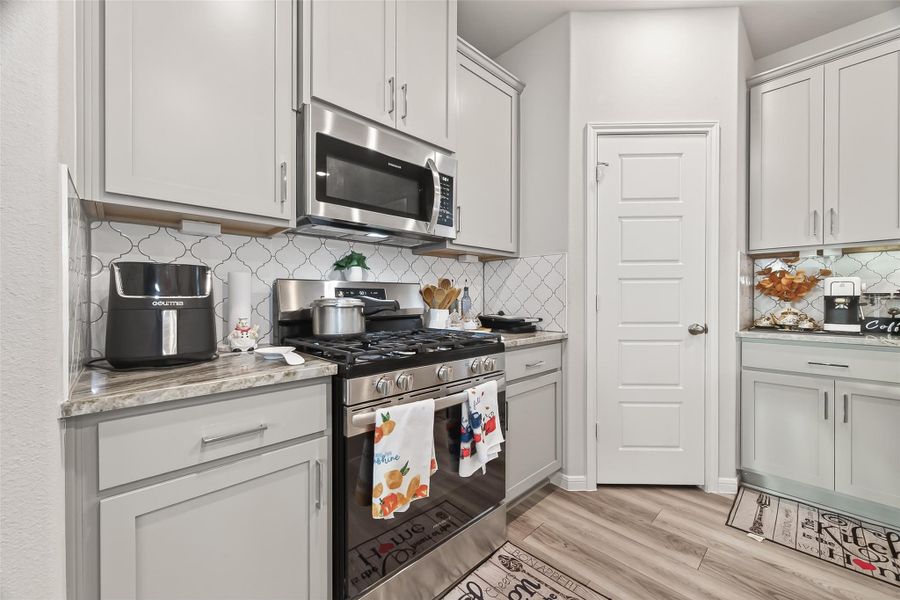 Furnished interior view inside a new home in Sunterra, Katy (Image 16).