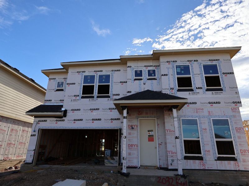 Front exterior of a new home in Barksdale, Leander, TX, highlighting curb appeal (Image 16). Front exterior of a new home in Barksdale, Leander, TX, highlighting curb appeal (Image 16).