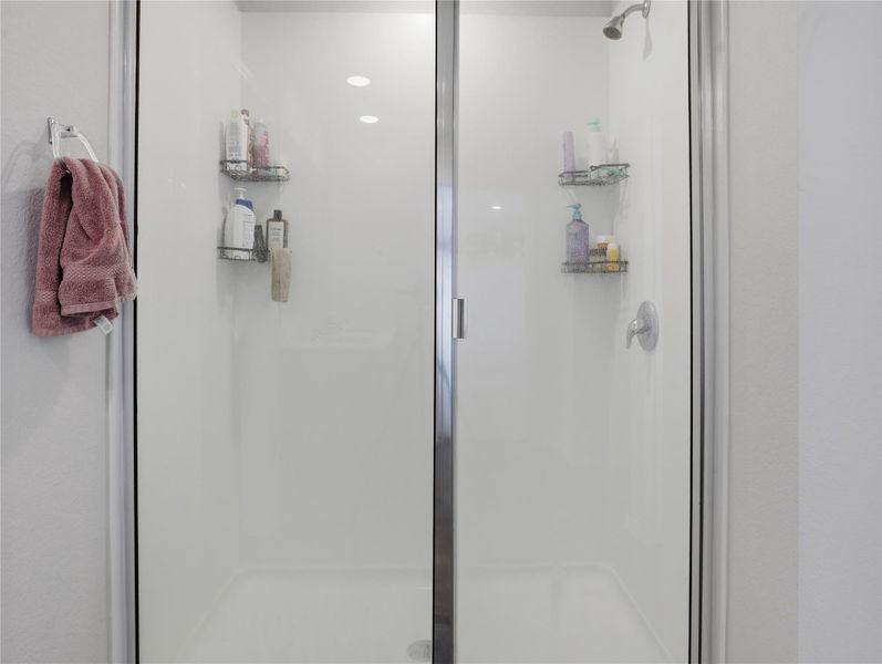Clean lines and a glass door define this modern walk-in shower enclosure. Clean lines and a glass door define this modern walk-in shower enclosure.