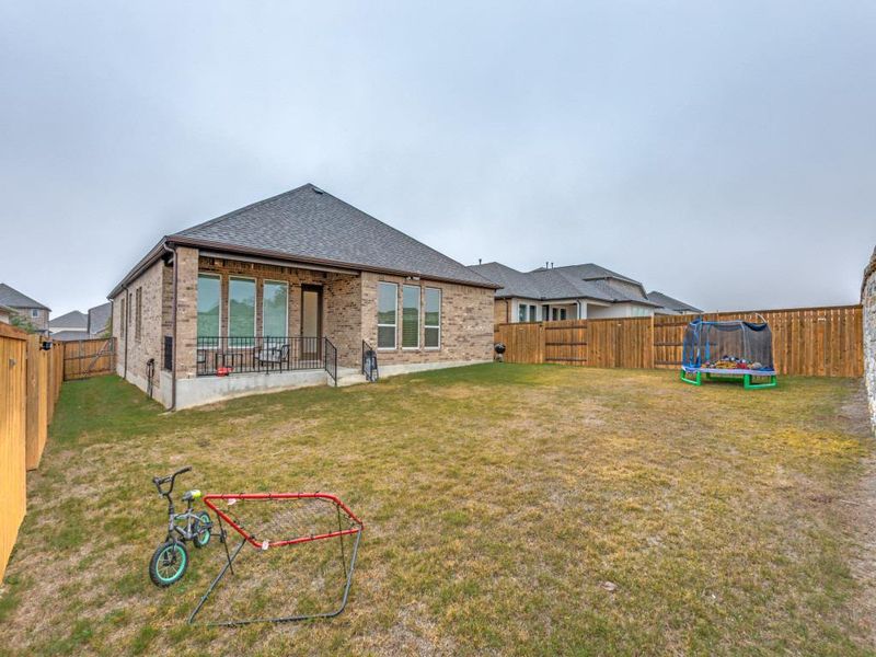 A wide-open backyard with plenty of room to play, garden, or host; it's fenced in and ready for whatever your days look like.