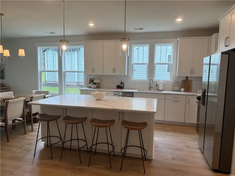 An open kitchen layout showcases a central island