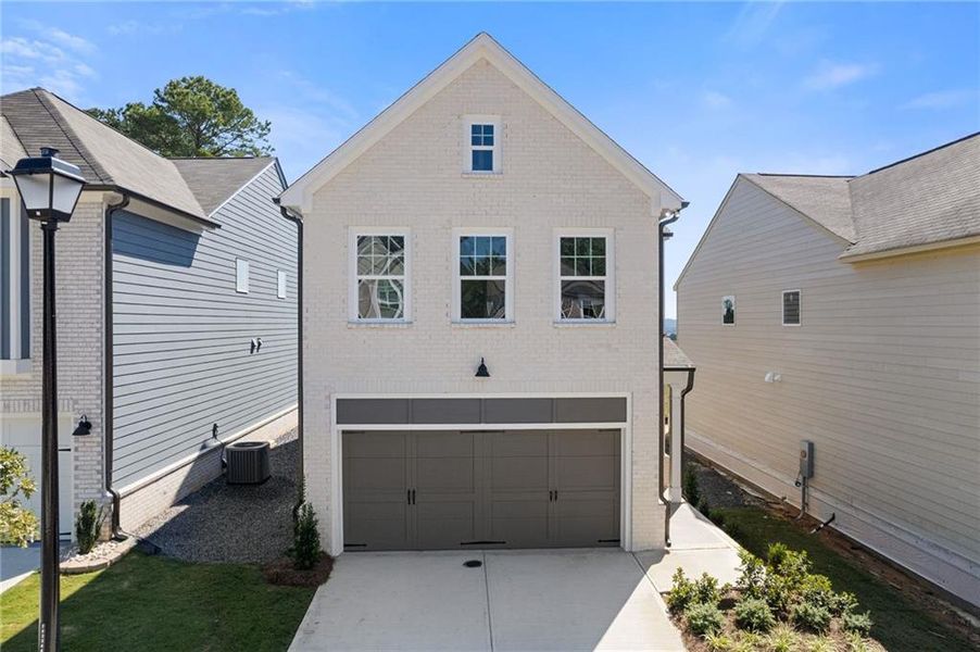 Front exterior of a new home in , Dacula, GA, highlighting curb appeal (Image 18).