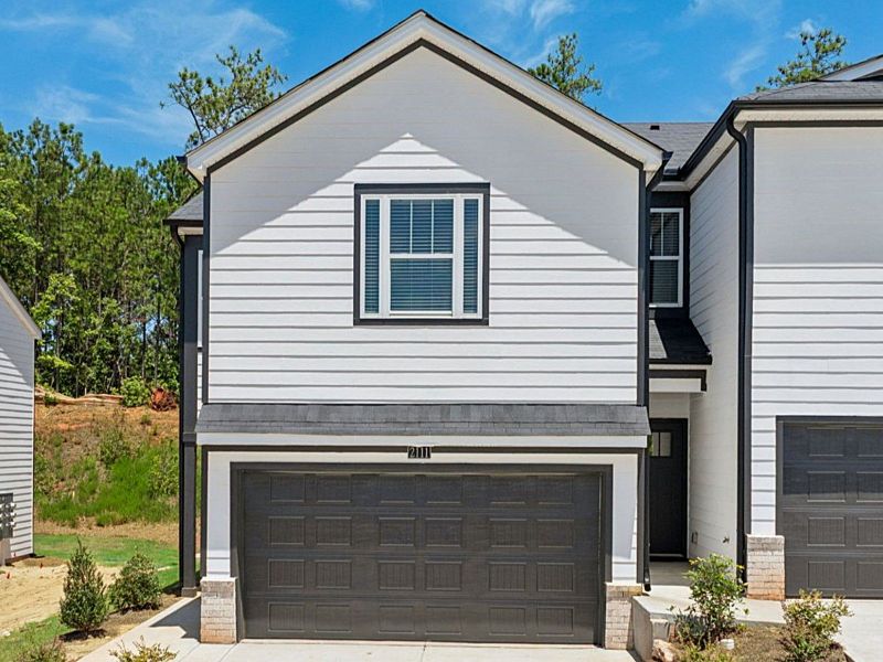 Front exterior of a new home in Avalon - Parc Series, Conyers, GA, highlighting curb appeal (Image 1).