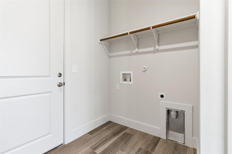 Laundry room with access to the attached garage