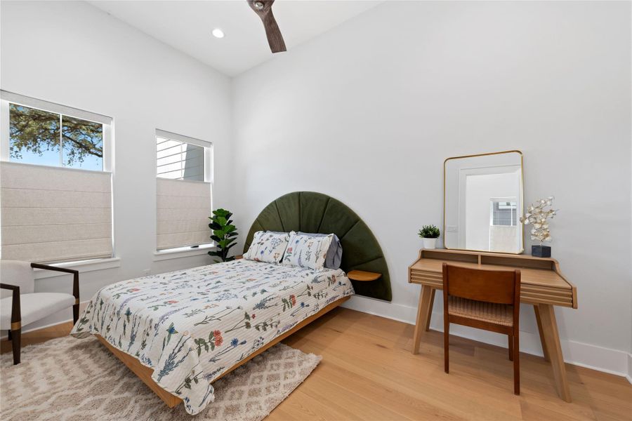 Downstairs full bedroom suite with tall ceilings and high end flooring. *Sample photos from another home with same floorplan. Downstairs full bedroom suite with tall ceilings and high end flooring. *Sample photos from another home with same floorplan.