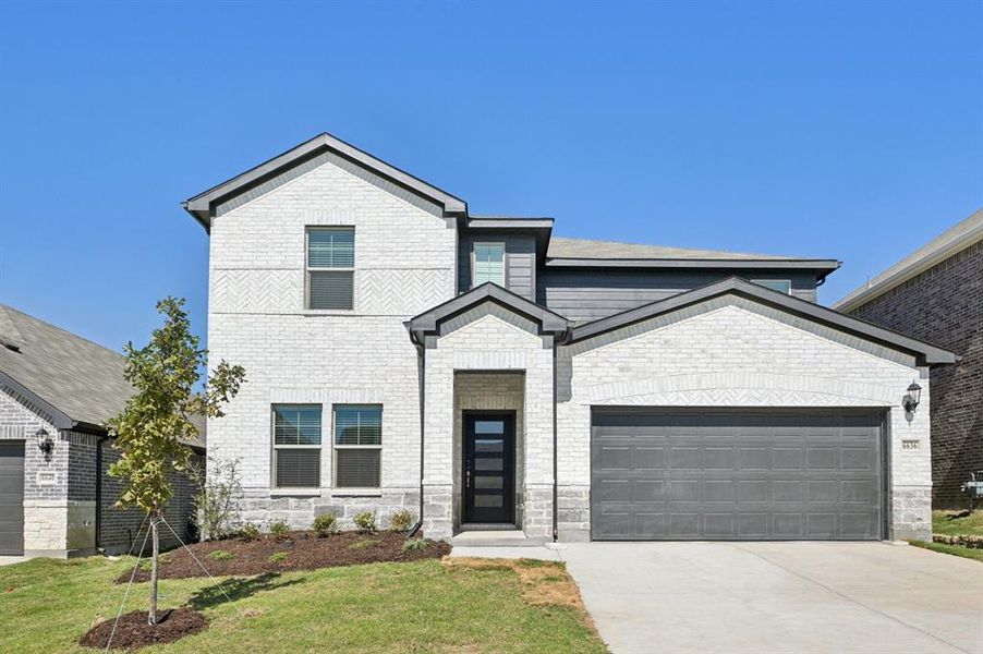 Front exterior of a new home in Tesoro at Chisholm Trail Ranch, Fort Worth, TX, highlighting curb appeal (Image 1).