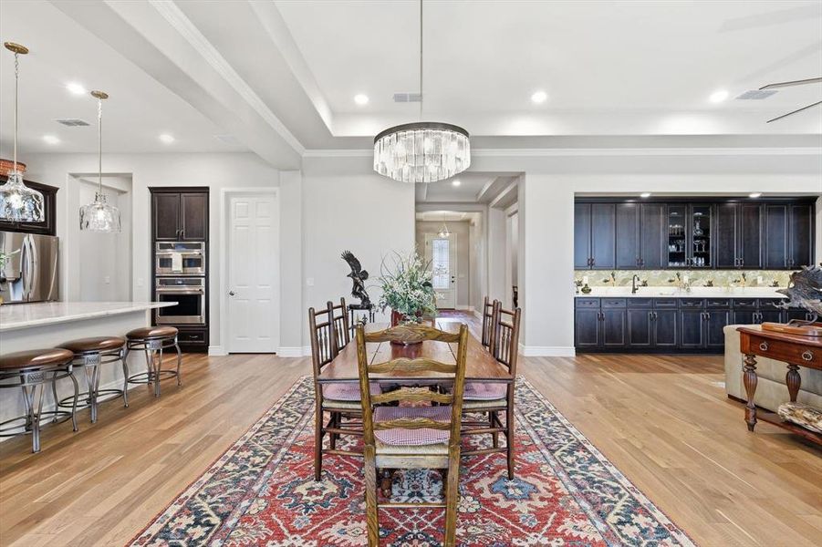 Perfectly situated between the Great Room and Gourmet Cook’s Kitchen, this Refined Dining Space features its own Double Sliding Glass Doors and Effortless Access to the Outdoor Pavilion Designed for Seamless Entertaining and offers an Elegant Setting for both Intimate Dinners and Grand Gatherings.