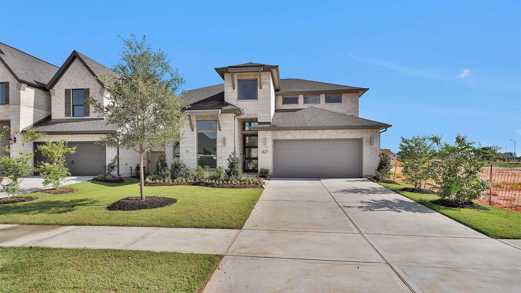 Front exterior of a new home in Grange 50', Katy, TX, highlighting curb appeal (Image 2). Front exterior of a new home in Grange 50', Katy, TX, highlighting curb appeal (Image 2).