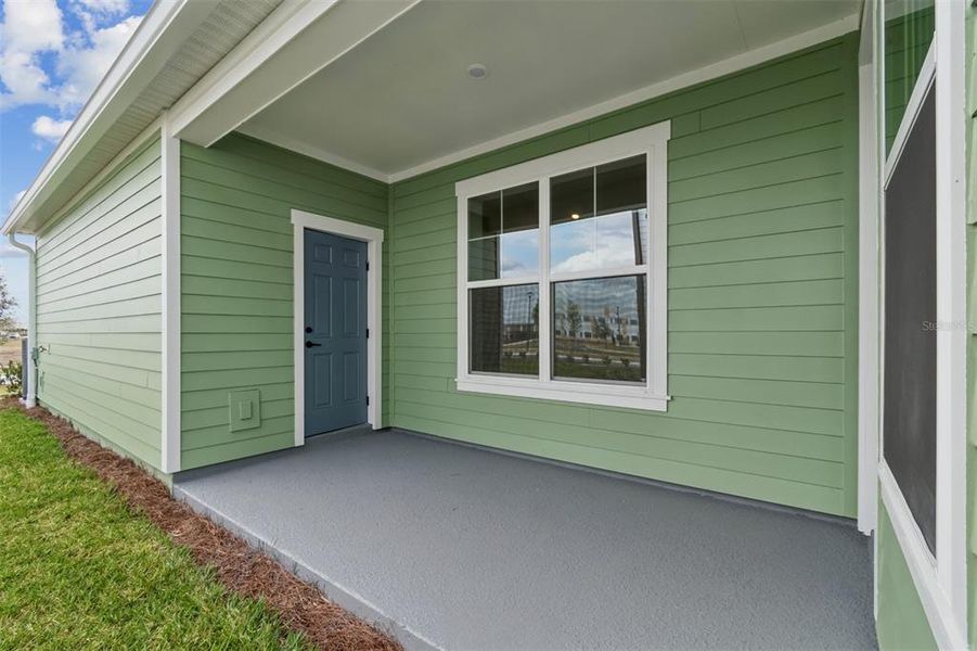 Exterior details and patio area of a home in Laureate Park at Lake Nona - Garden Series, Orlando (Image 3).