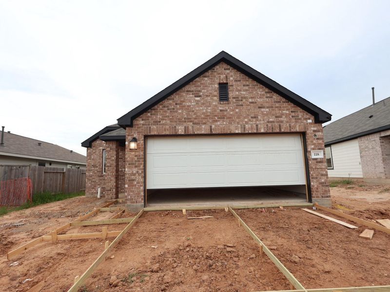 Front exterior of a new home in Magnolia Ridge, Magnolia, TX, highlighting curb appeal (Image 16). Front exterior of a new home in Magnolia Ridge, Magnolia, TX, highlighting curb appeal (Image 16).