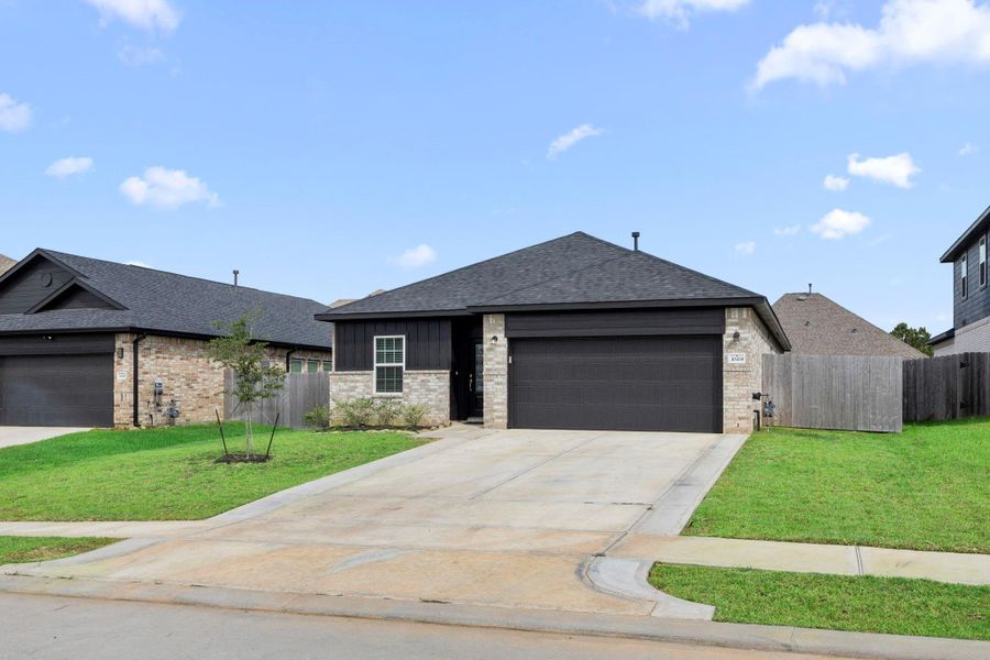 Front exterior of a new home in Glen Oaks, Magnolia, TX, highlighting curb appeal (Image 21). Front exterior of a new home in Glen Oaks, Magnolia, TX, highlighting curb appeal (Image 21).