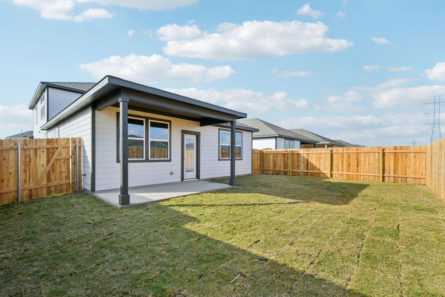 Exterior details and patio area of a home in Stallion Run, Buda (Image 3).