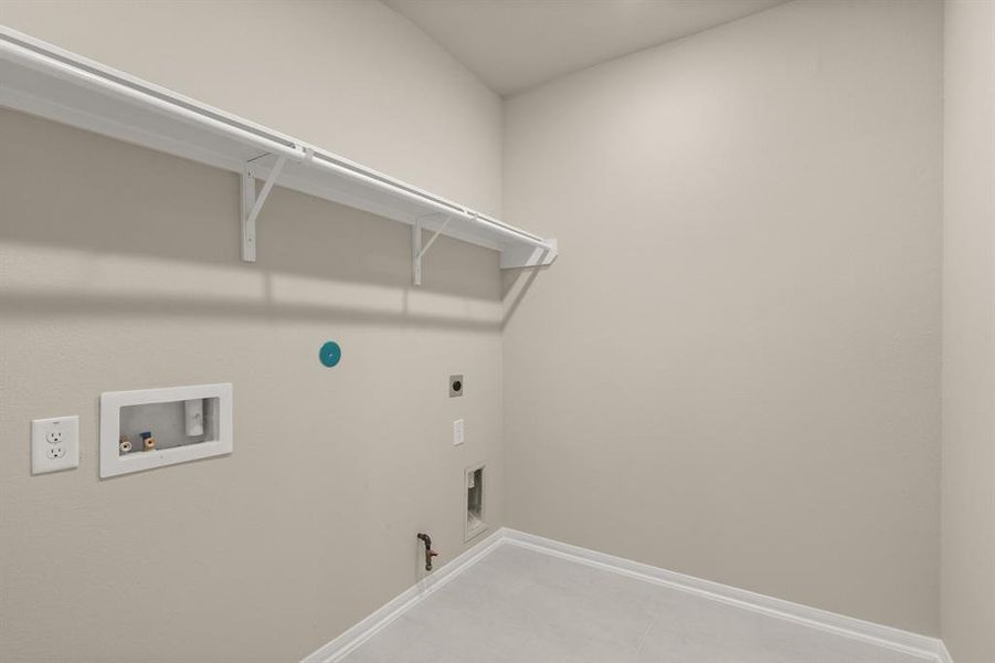 The laundry room layout is carefully planned for optimal workflow with designated areas for washing, drying, and storing.