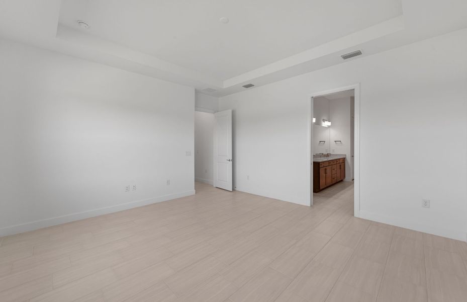 Owner's private suite featuring a drop tray ceiling