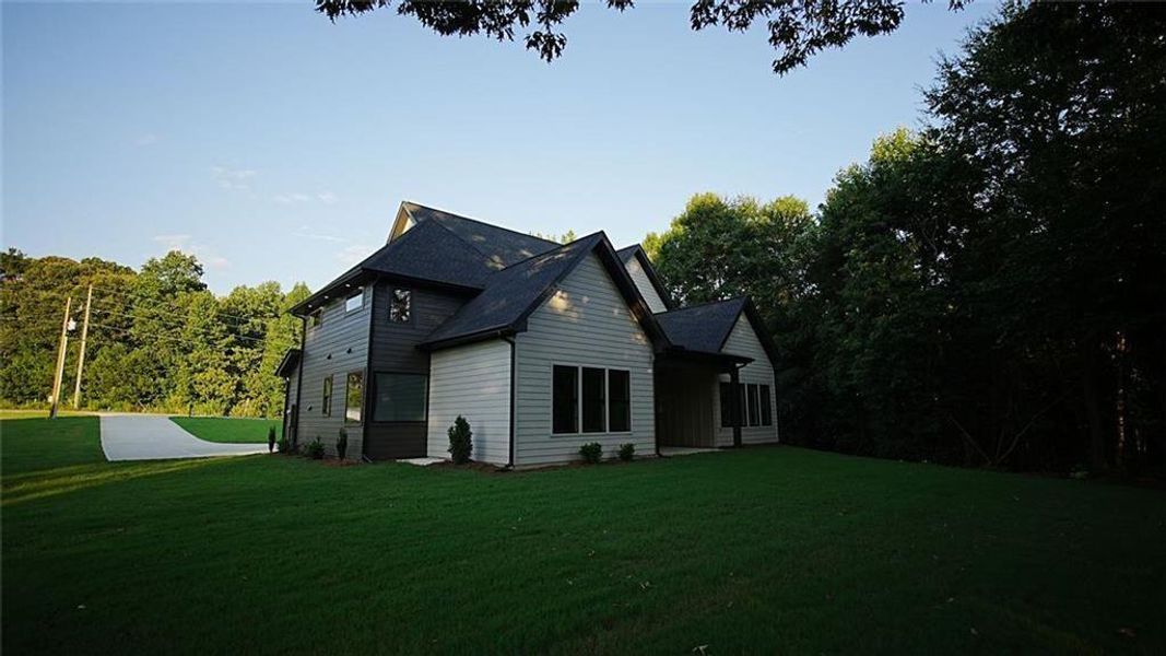 Front exterior of a new home in , Flowery Branch, GA, highlighting curb appeal (Image 28). Front exterior of a new home in , Flowery Branch, GA, highlighting curb appeal (Image 28).