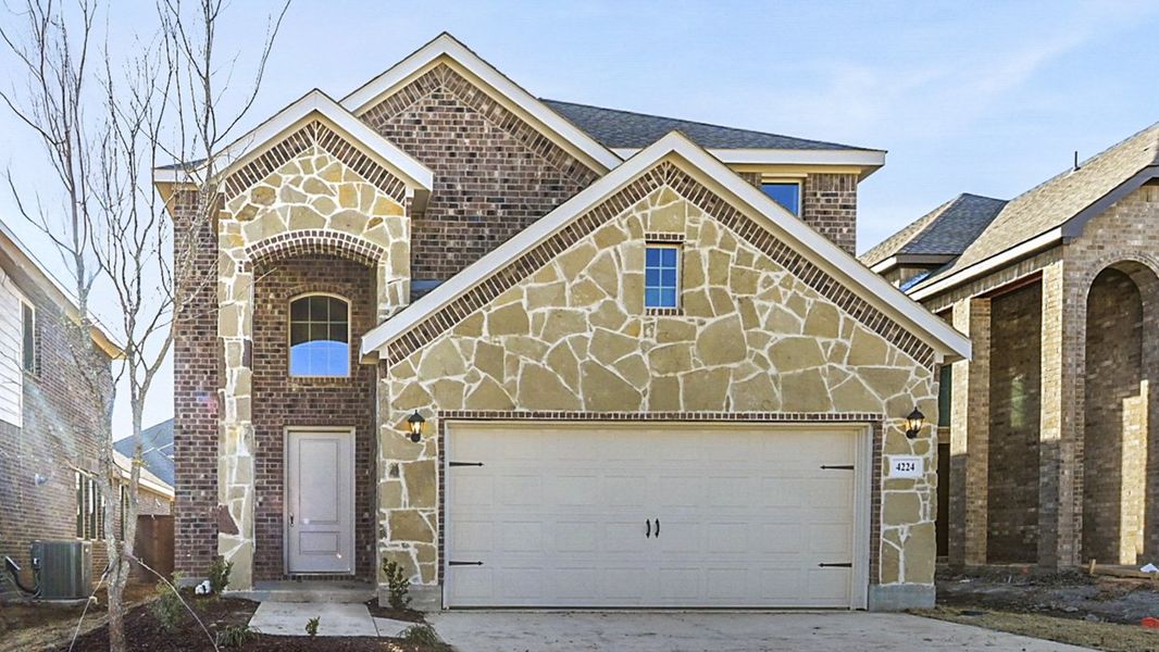 Front exterior of a new home in The Woods at Lindsey Place, Anna, TX, highlighting curb appeal (Image 1).