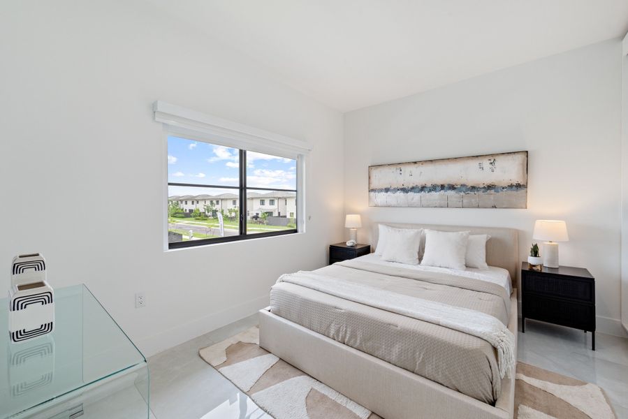 Representative furnished interior of a home built from the Model E by Onx Homes in On Alba, Florida City (Image 49).