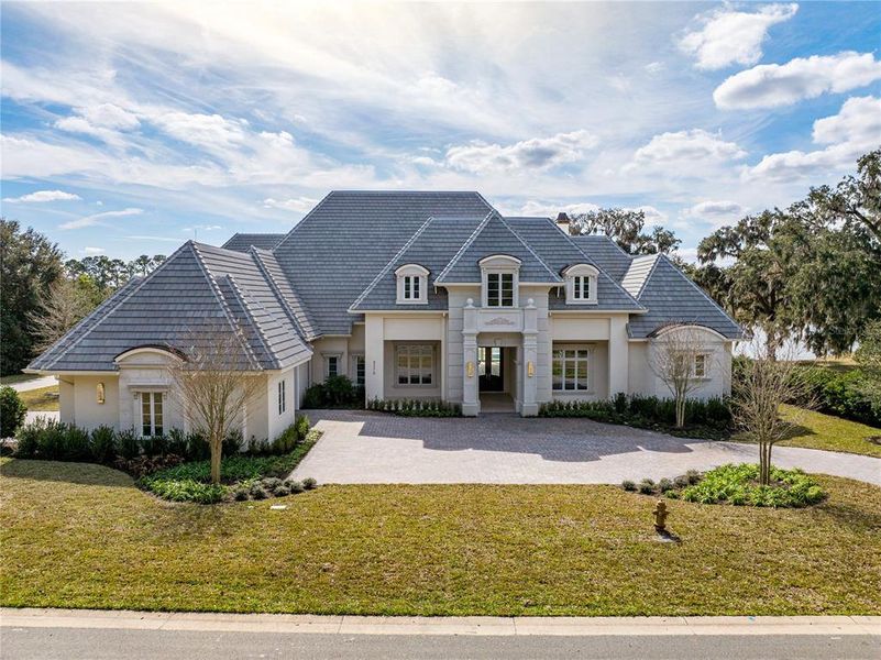 Front exterior of a new home in , Ocala, FL, highlighting curb appeal (Image 21).