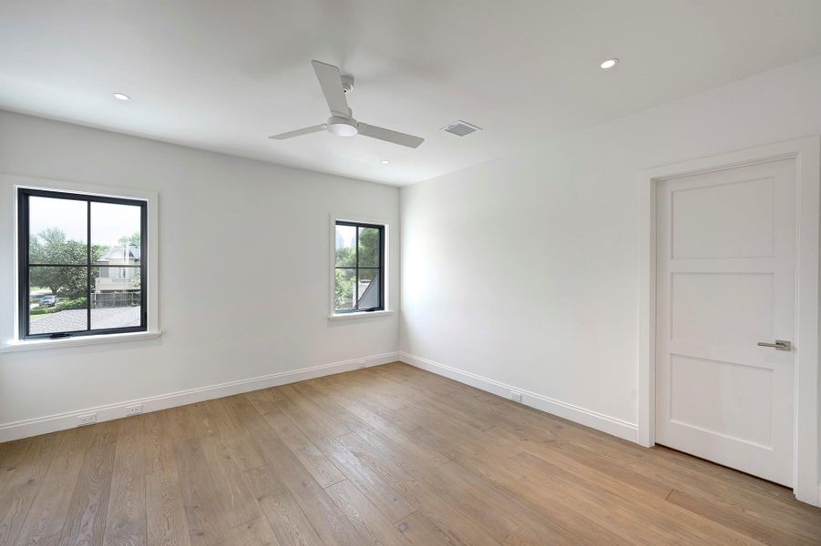 Fourth bedroom with ensuite bath and large walk-in closet.