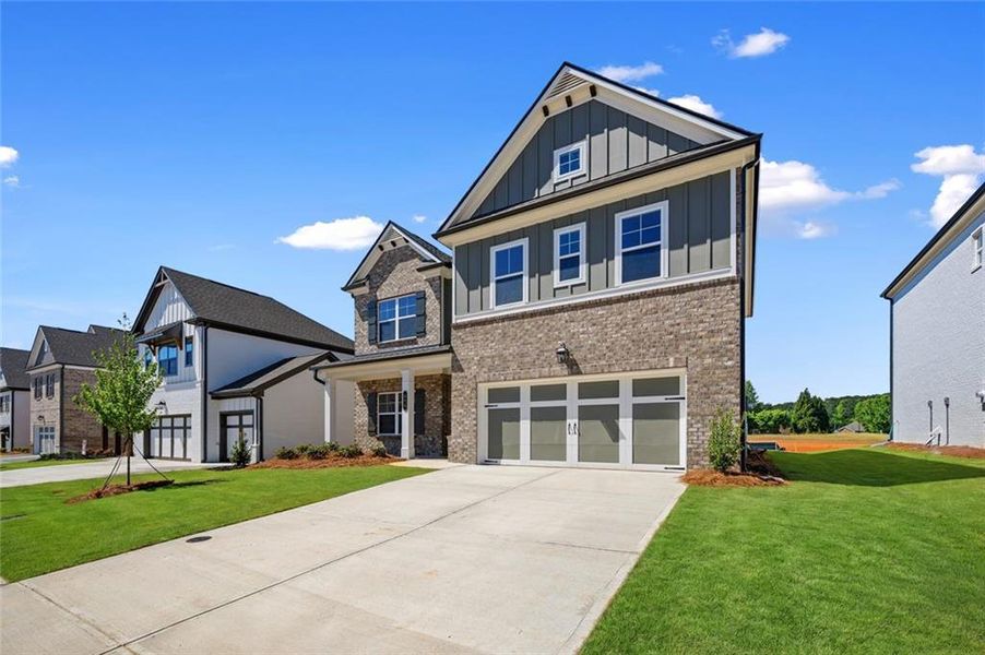 Front exterior of a new home in Greenefield, Cartersville, GA, highlighting curb appeal (Image 1). Front exterior of a new home in Greenefield, Cartersville, GA, highlighting curb appeal (Image 1).
