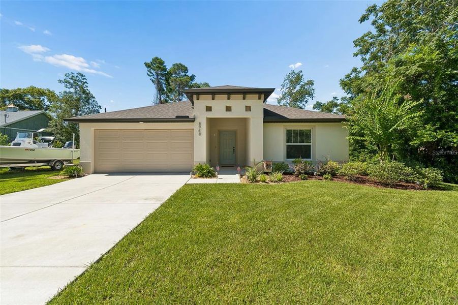 Front exterior of a new home in , Weeki Wachee, FL, highlighting curb appeal (Image 24).