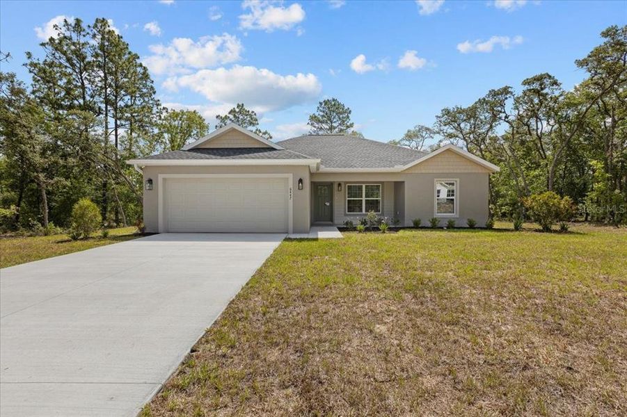 Front exterior of a new home in , Citrus Springs, FL, highlighting curb appeal (Image 24).