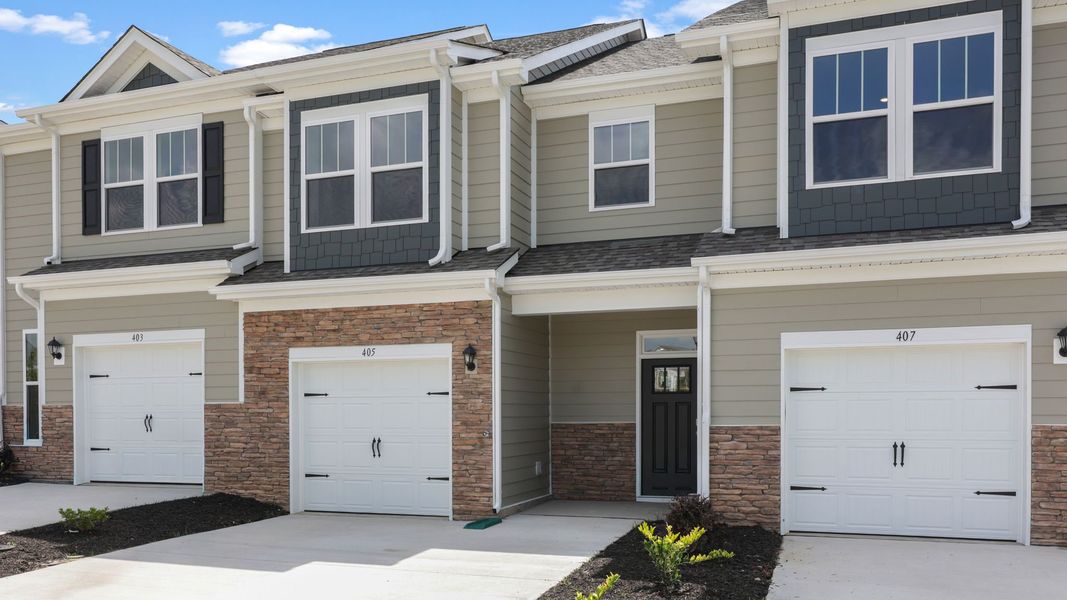 Front exterior of a new home in The Townes at Stonecrest, Hendersonville, NC, highlighting curb appeal (Image 2). Front exterior of a new home in The Townes at Stonecrest, Hendersonville, NC, highlighting curb appeal (Image 2).