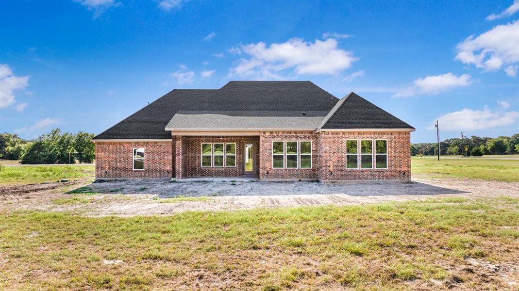 Front exterior of a new home in , Greenville, TX, highlighting curb appeal (Image 1). Front exterior of a new home in , Greenville, TX, highlighting curb appeal (Image 1).