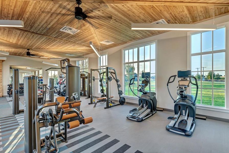 Exercise room featuring wood ceiling and a ceiling fan Exercise room featuring wood ceiling and a ceiling fan