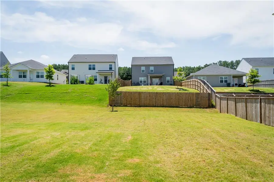 Front exterior of a new home in Summerwind, Dacula, GA, highlighting curb appeal (Image 2).