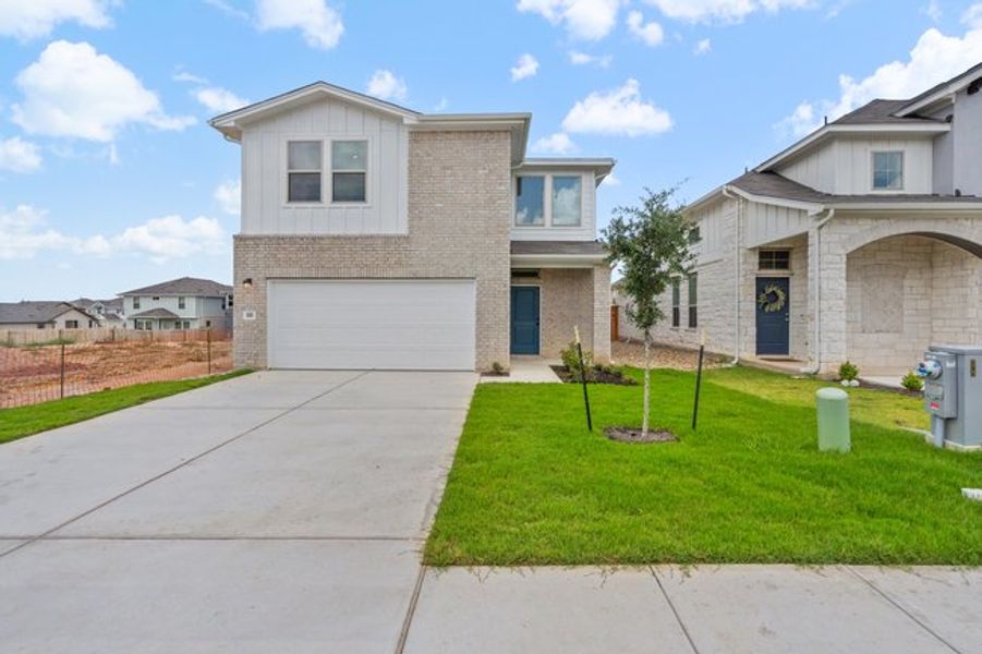 Front exterior of a new home in Crosswinds, Kyle, TX, highlighting curb appeal (Image 8).