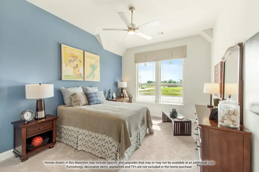 Bedroom with blue accent wall, vaulted ceiling, ceiling fan, and large window with outdoor view Bedroom with blue accent wall, vaulted ceiling, ceiling fan, and large window with outdoor view