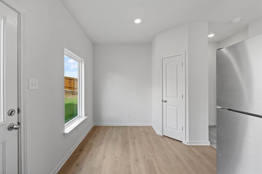 Dining area with wood-style flooring