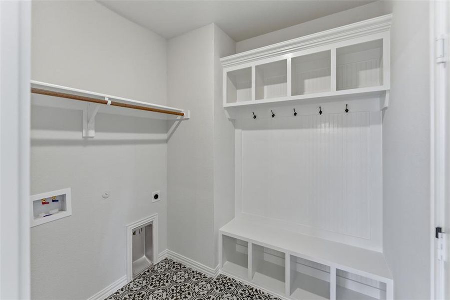 Laundry area featuring hookup for a gas dryer, washer hookup, and hookup for an electric dryer