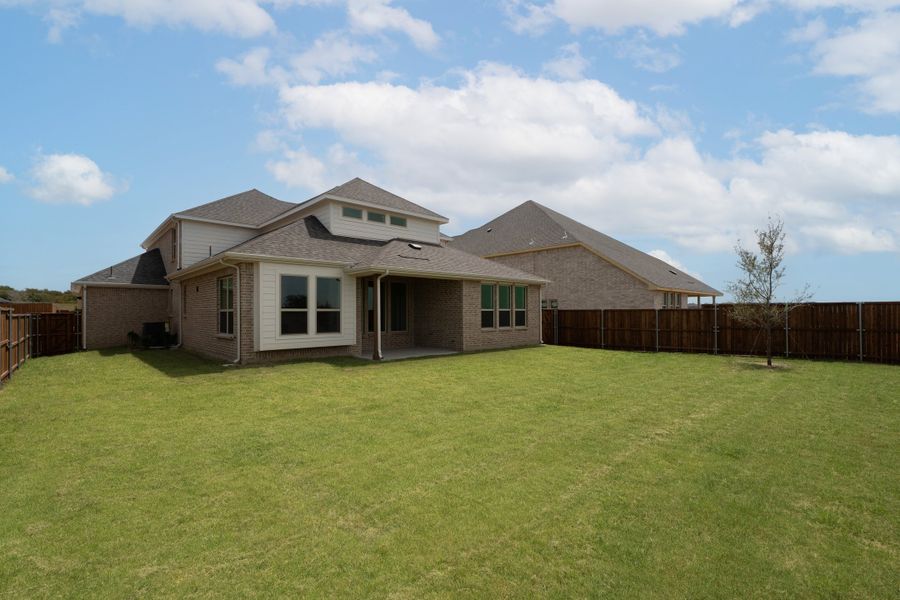 Exterior details and patio area of a home in Enclave at Legacy Hills, Celina (Image 2).