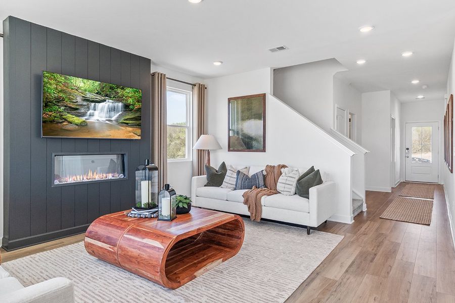 A living room with a fireplace.