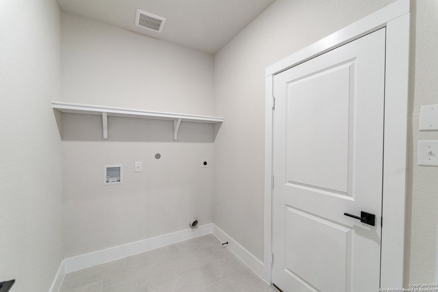 Spacious, unfurnished interior of a new home in The Woodlands at Medina Hills, Mico (Image 14).