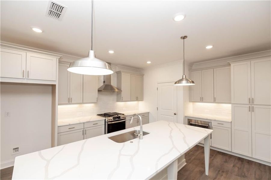 Garage off of kitchen great for groceries. - Pictures represent a previously built home, not the actual home.