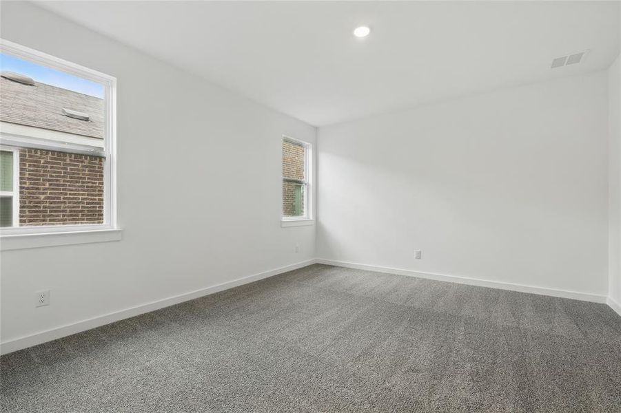Spare room featuring carpet flooring and recessed lighting