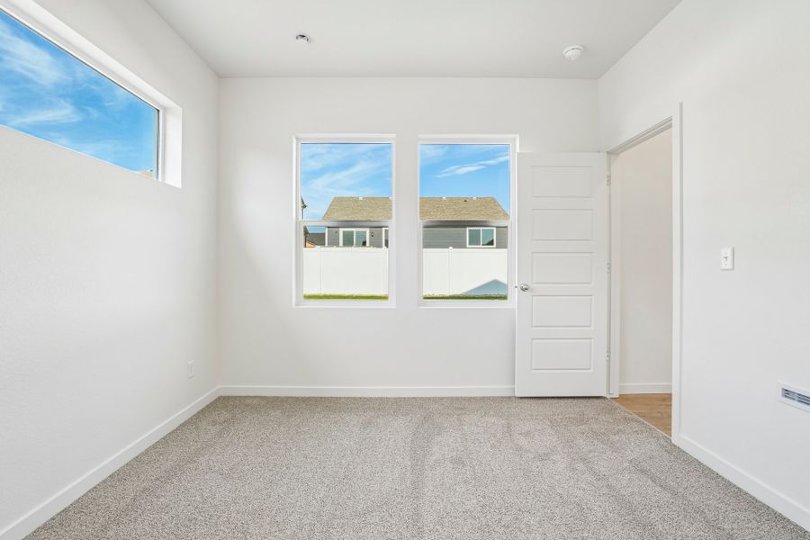 Spacious, unfurnished interior of a new home in Union Colony West, Greeley (Image 20).