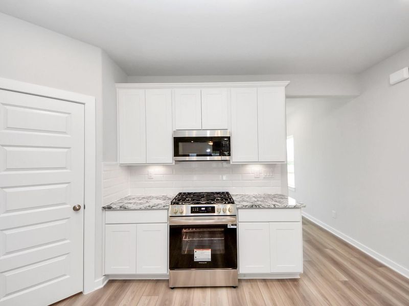 Furnished interior view inside a new home in Windmill Estates, Magnolia (Image 11).