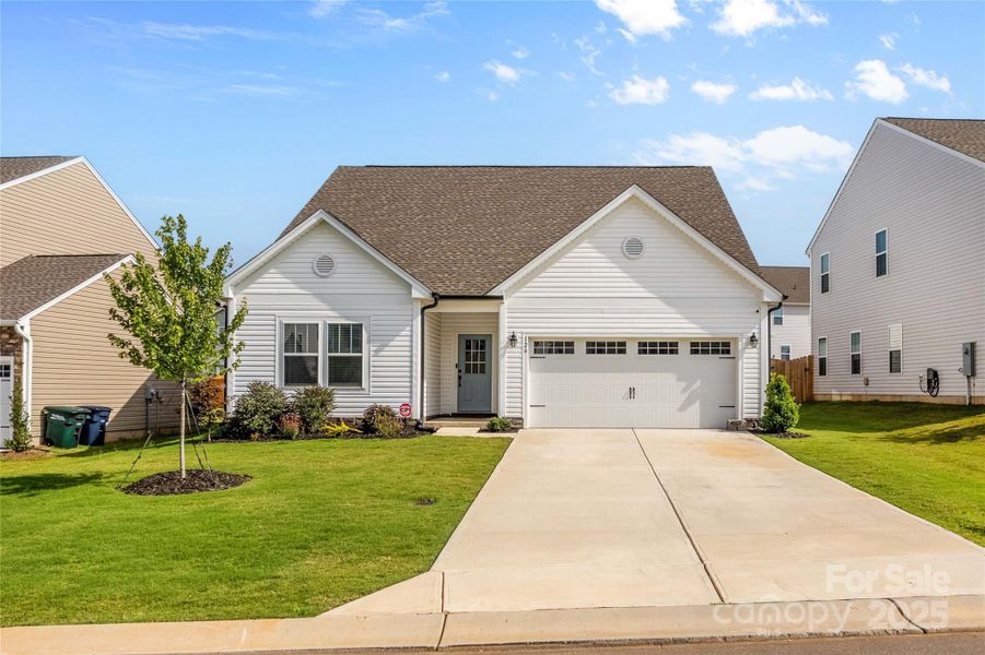 Front exterior of a new home in , Troutman, NC, highlighting curb appeal (Image 27).