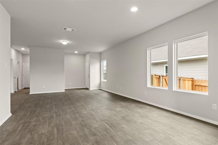 Unfurnished room with recessed lighting and dark wood-style flooring