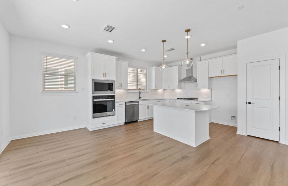 Representative furnished interior of a home built from the Alexander by Pulte Homes in Wolf Ranch, Georgetown (Image 7).