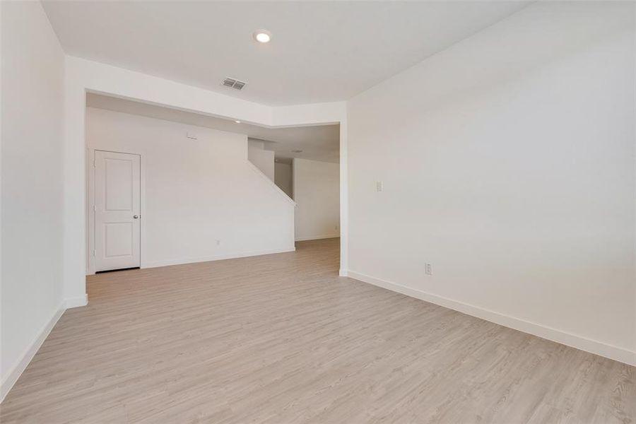 Spare room featuring light wood-type flooring