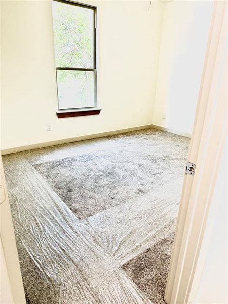 Unfurnished room with carpet flooring