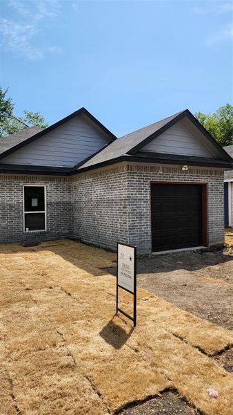 View of front of property with a garage