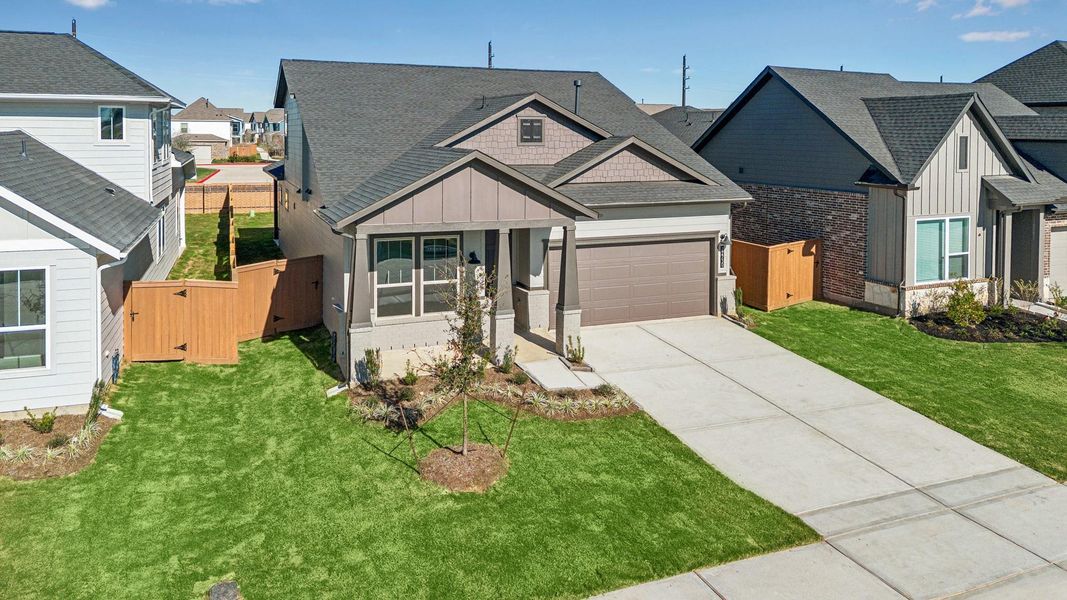 Front exterior of a new home in Elyson, Katy, TX, highlighting curb appeal (Image 26).