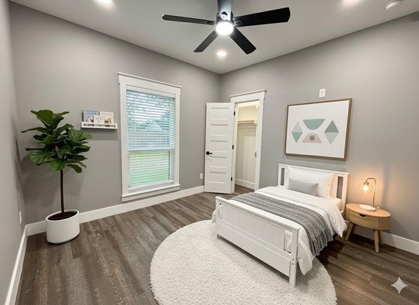 Bedroom featuring dark wood finished floors, a ceiling fan, a spacious closet, and recessed lighting Bedroom featuring dark wood finished floors, a ceiling fan, a spacious closet, and recessed lighting