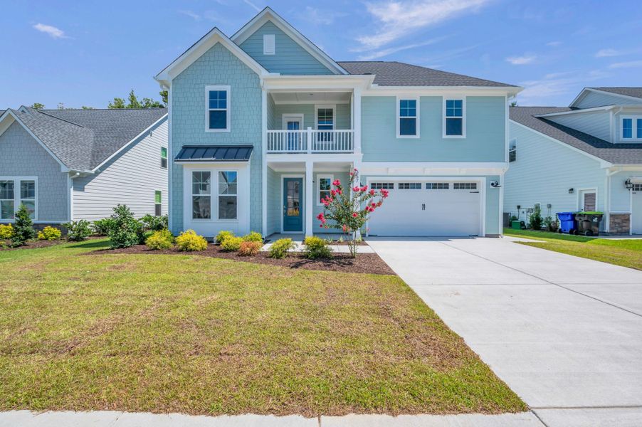 Representative exterior photo of a completed home built from the The Highland by RobuckHomes in Windwater, Hampstead, NC (Image 25).